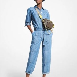Michael Kors Denim Jumpsuit with Gold Accents. Full length, long sleeves, belted